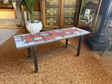 a table that has a red and black checkered pattern on it