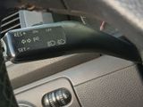 a close up of a car ' s dashboard with a remote control