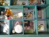 many different bottles of perfume in a blue box