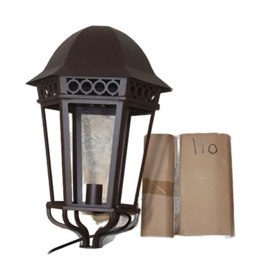 an image of a lamp post with a brown paper bag next to it