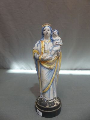 figurine of a woman holding a child in her arms