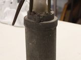 a small lantern sitting on a table in a room