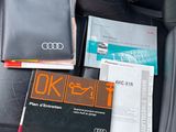 a car seat with books and a wallet on it