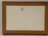 an old picture frame with a picture of a face on it