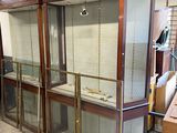 a large display case with glass doors in a room