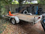 a trailer with a trailer attached to it in the yard