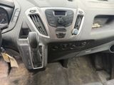 a dashboard of a car with a steering control panel