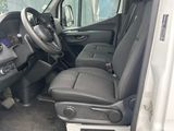 the interior of a white van with the driver ' s seat up