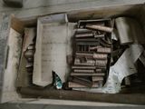 a box full of metal items sitting on the floor