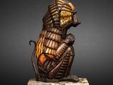 a bronze statue of a monkey sitting on a marble base