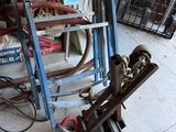 a pile of junk on the floor in a garage