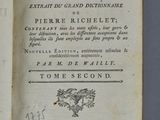 an open book with a picture of a bird on it