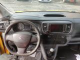 dashboard of a car with a steering wheel and dashboard controls