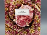a book with a pink cover and gold foil on it