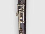 a close up of a clarinet on a white background