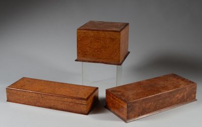 three small wooden boxes sitting next to each other on a table