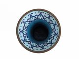 a small blue and white bowl with a brown rim