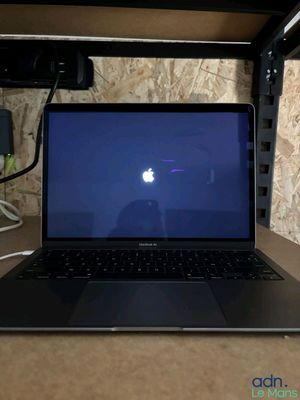 a laptop computer that is sitting on a desk
