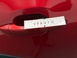 a sticker that says vauto on the side of a red car
