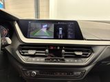 the dashboard of a car with a gps device in the center
