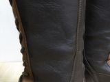 a close up of a pair of brown boots on a table