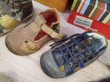 many pairs of shoes that are on a table