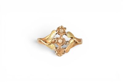 a close up of a gold ring on a white background