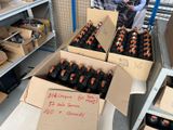 several boxes of beer are stacked on top of each other in a warehouse