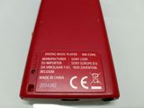 a red cell phone that is sitting on a table