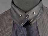 a close up of a shirt and tie on a mannequin