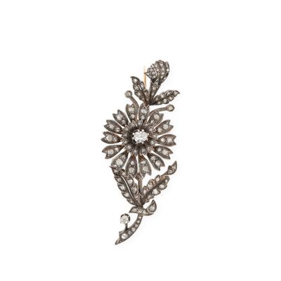 an antique diamond flower broochle