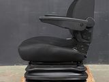a black office chair sitting on top of a wooden pallet