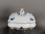 a white and blue box with a bird on it