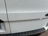 a close up of a white car with a license plate on it
