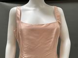 a close up of a mannequin wearing a pink dress on a mannequin mannequin