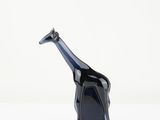 a glass giraffe that is sitting on a table