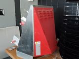 a red toaster and a black toaster on a wooden table