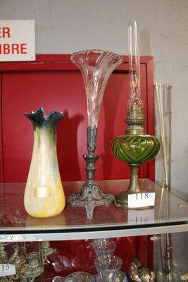 many glass vases on a glass shelf in a room