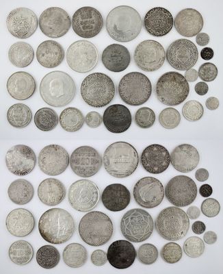 a collection of silver and silver coins from around the world