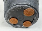a close up of a metal object on a white surface