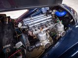 a blue car with an engine in it ' s trunk