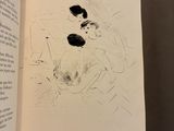an open book with a drawing of a dog on it