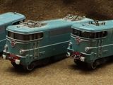 a group of toy trains sitting next to each other on a table