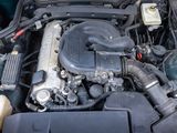 a picture of a car engine with its hood open