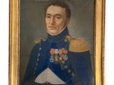 portrait of a man in a military uniform in a gold frame