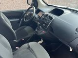 the interior of a small car with black seats and a steering wheel