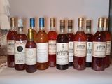 several bottles of wine are lined up on a table