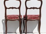 two chairs that are sitting next to each other