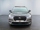 the front view of a grey dsx parked in a room