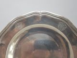 a silver plate that is sitting on a table